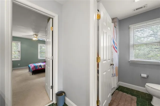 a bedroom with bed and window