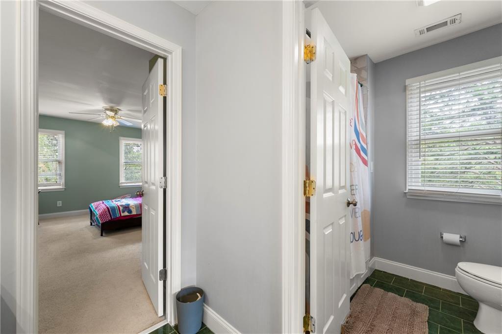 244 Dodgen Road Hampton, GA 30228 - Photo 34 of 55 a bedroom with a bed and a window