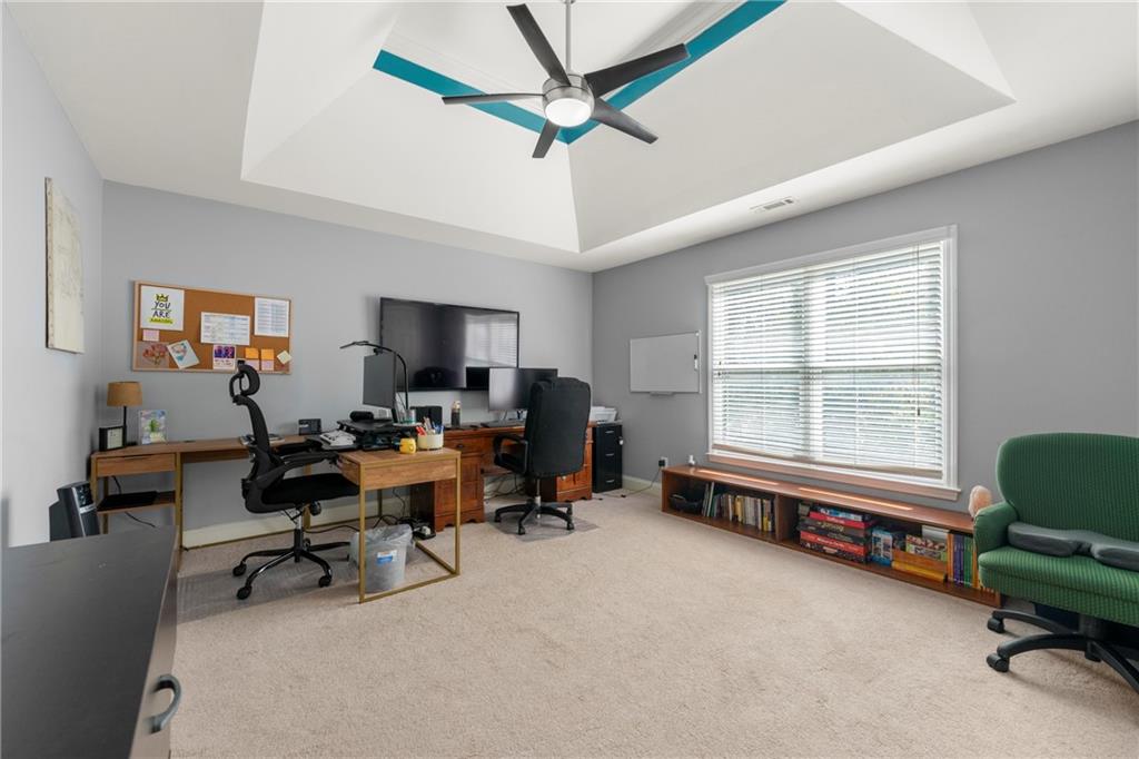 244 Dodgen Road Hampton, GA 30228 - Photo 35 of 55 a living room with furniture and a large window