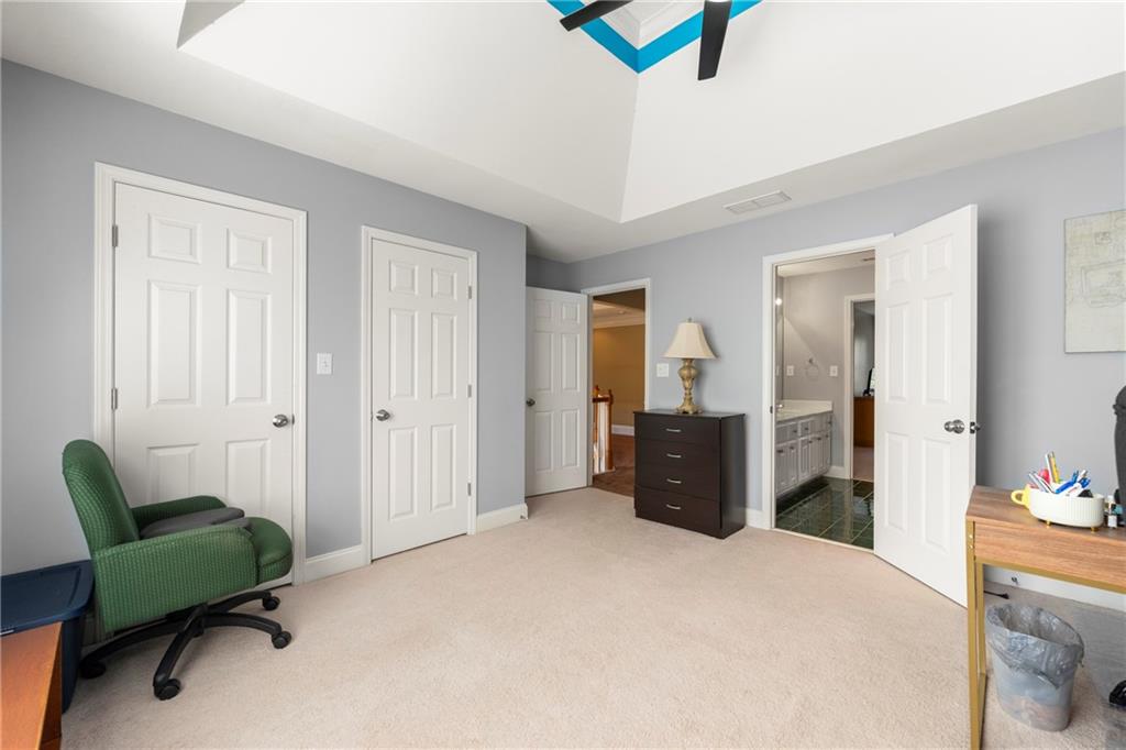 244 Dodgen Road Hampton, GA 30228 - Photo 36 of 55 a bedroom with furniture and a window