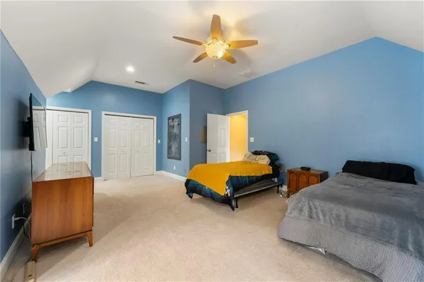 a view of empty room with windows and air conditioner