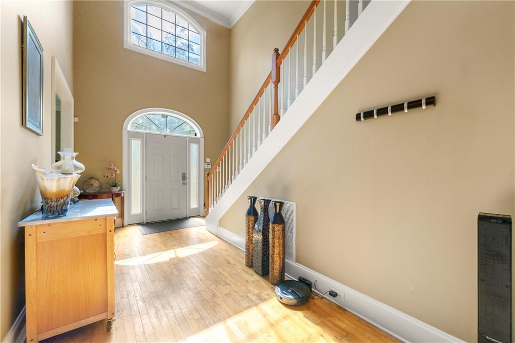 244 Dodgen Road Hampton, GA 30228 - Photo 6 of 55 a view of hallway with stairs and wooden floor