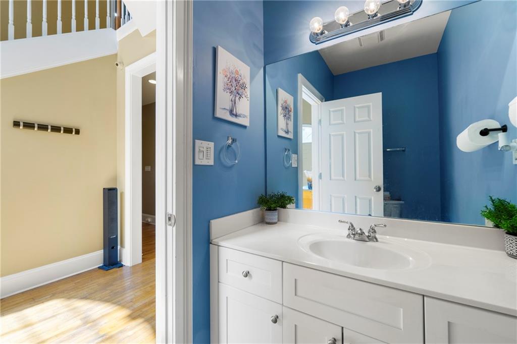 244 Dodgen Road Hampton, GA 30228 - Photo 7 of 55 a bathroom with a sink and a mirror