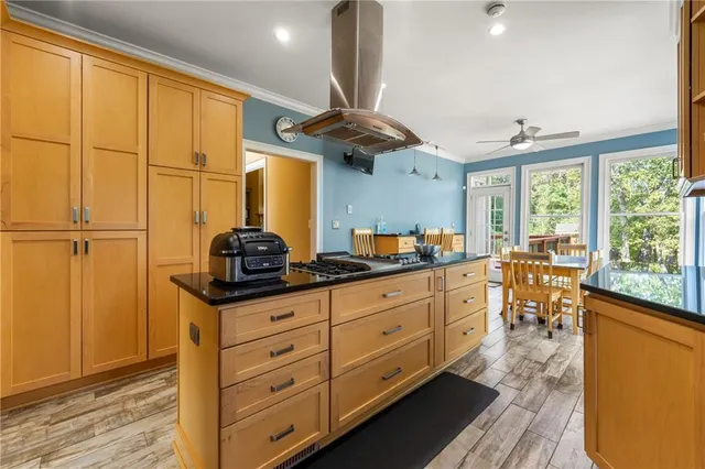 a kitchen with stainless steel appliances a refrigerator sink and cabinets