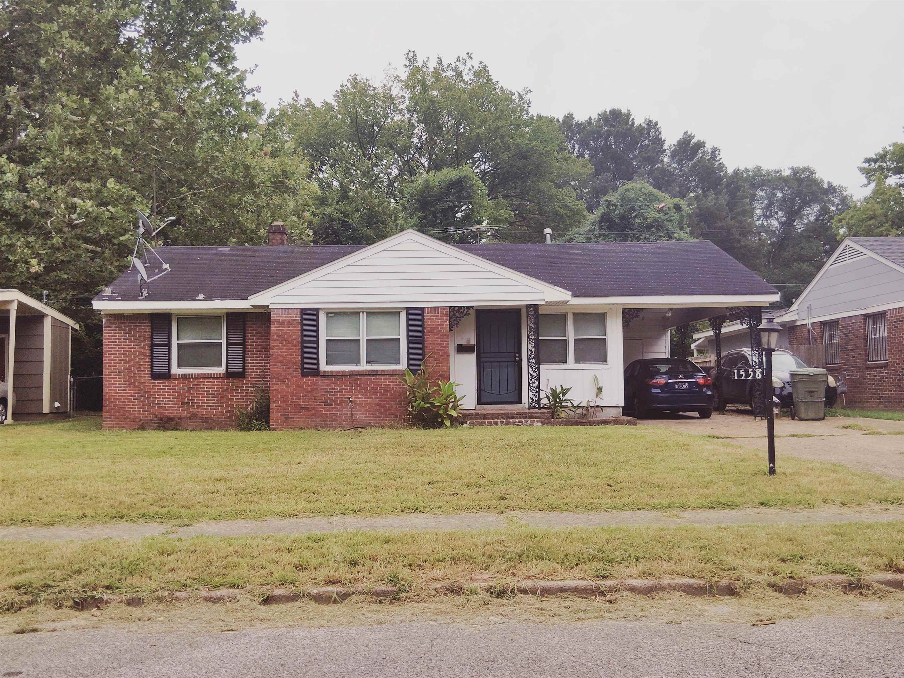 1558 Patterson Street Memphis, TN 38111 - Photo 3 of 11 a front view of a house with a garden