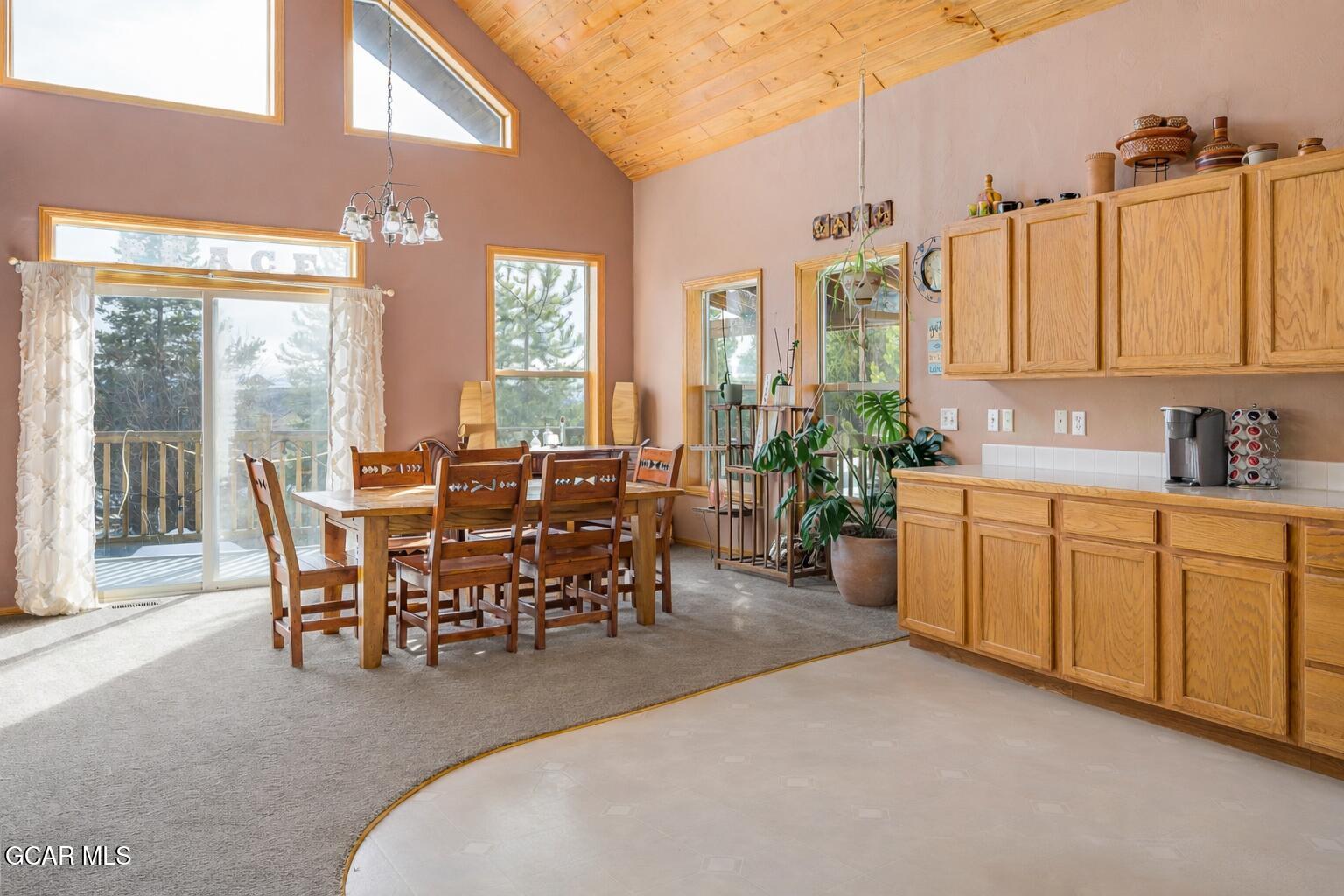 300 County Road Grand Lake, CO 80447 - Photo 13 of 47 a view of a a dining room with furniture window and outside view