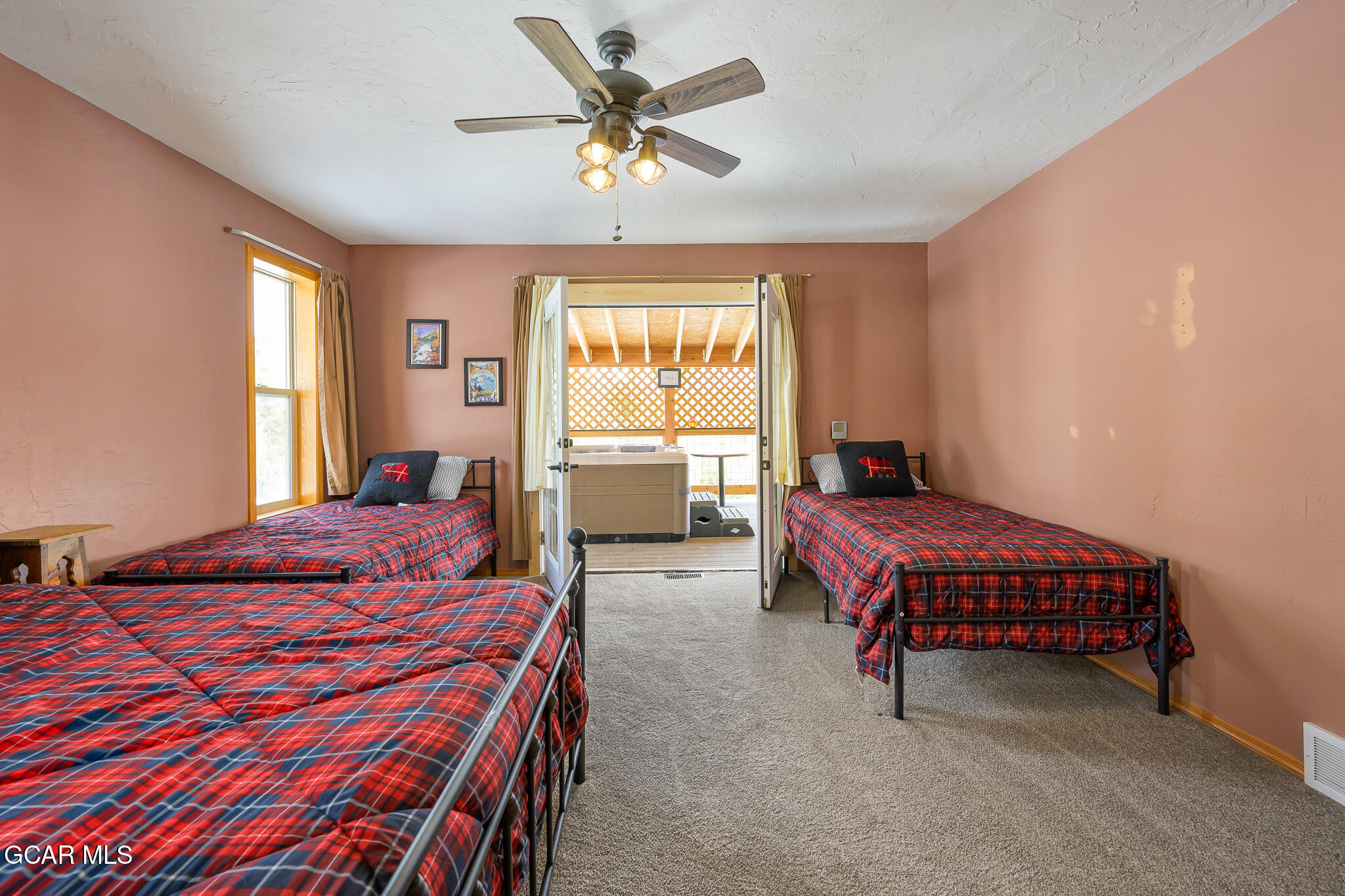 300 County Road Grand Lake, CO 80447 - Photo 21 of 47 a bedroom with a bed and a chandelier