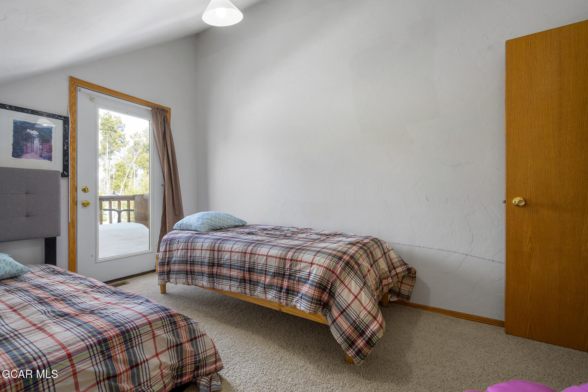 300 County Road Grand Lake, CO 80447 - Photo 32 of 47 a bedroom with a bed and window