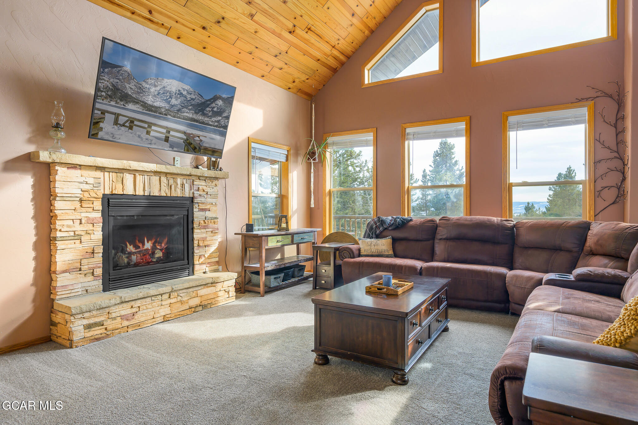300 County Road Grand Lake, CO 80447 - Photo 4 of 47 a living room with furniture large window and a fireplace