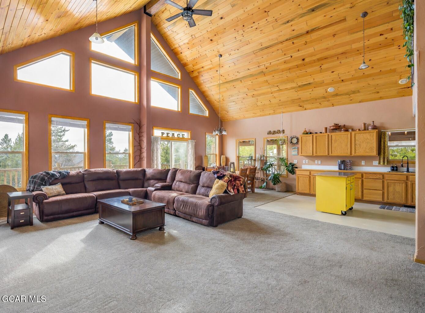 300 County Road Grand Lake, CO 80447 - Photo 7 of 47 a living room with couches and kitchen view