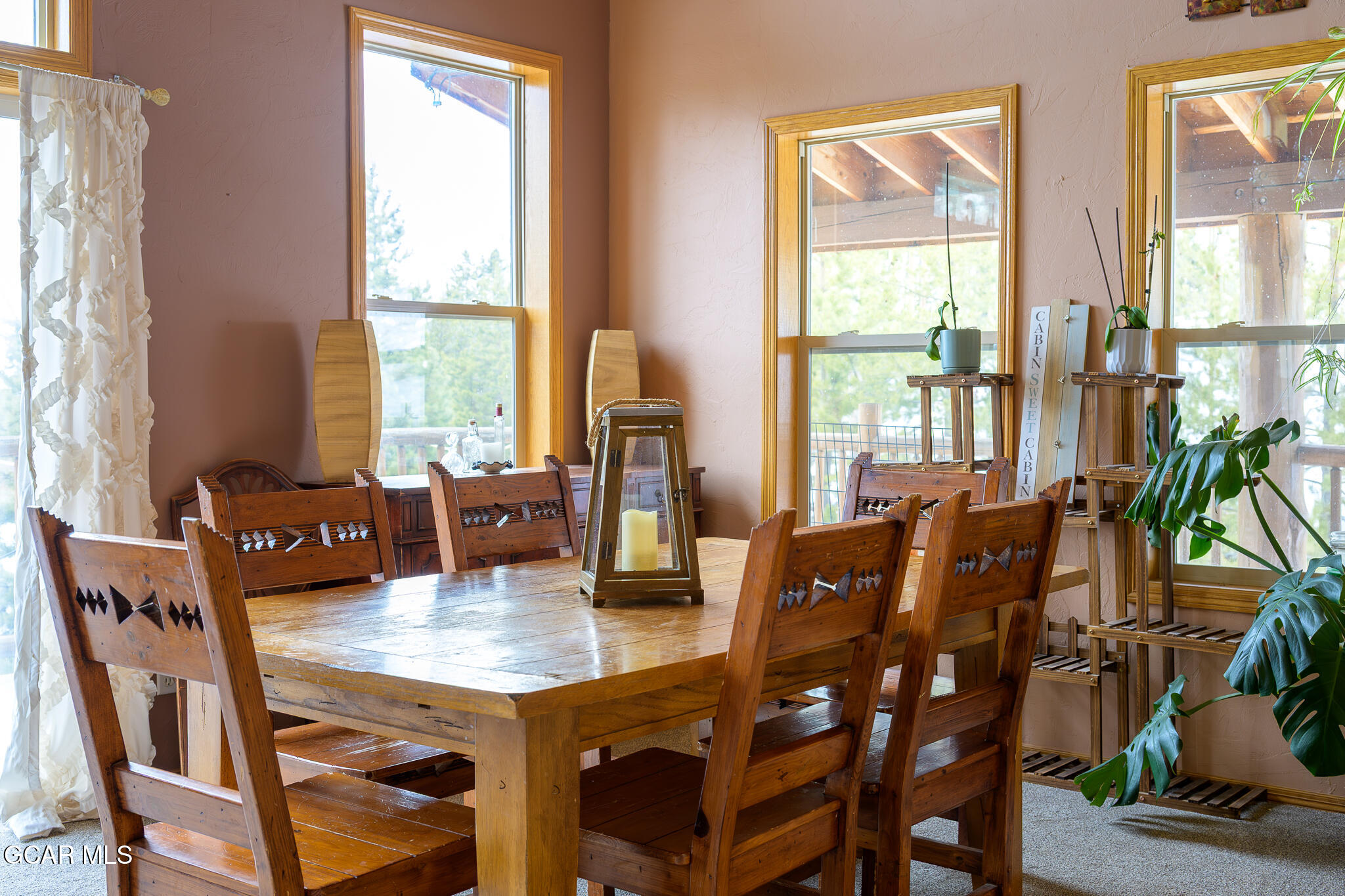 300 County Road Grand Lake, CO 80447 - Photo 9 of 47 a view of a dining room with furniture window and outside view