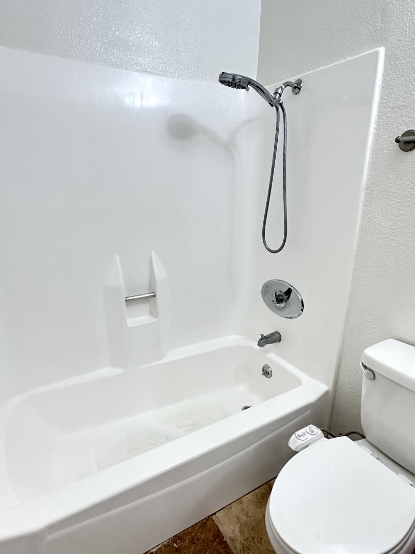 436 Dempsey Road, Unit 238 Milpitas, CA 95035 - Photo 5 of 16 a bathroom with a toilet and a bath tub