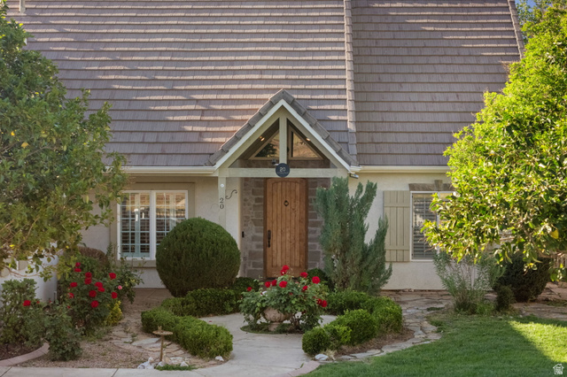 20 Valley Road Leeds, UT 84746 - Photo 55 of 57 Gabled entryway featuring a carved wood-finish door with decorative hardware, framed by stone veneer accents