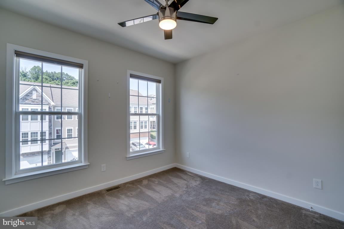19958 Abram Terrace Ashburn, VA 20147 - Photo 28 of 41 an empty room with windows and fan