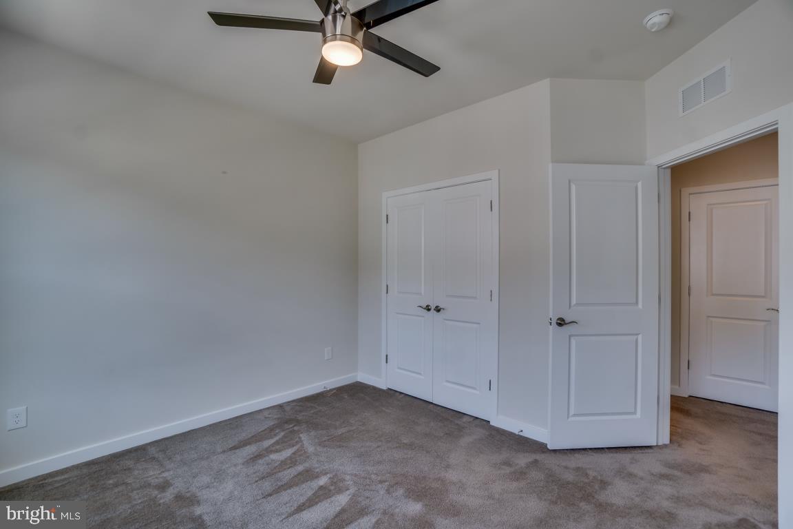 19958 Abram Terrace Ashburn, VA 20147 - Photo 29 of 41 a view of a livingroom with a ceiling fan and window