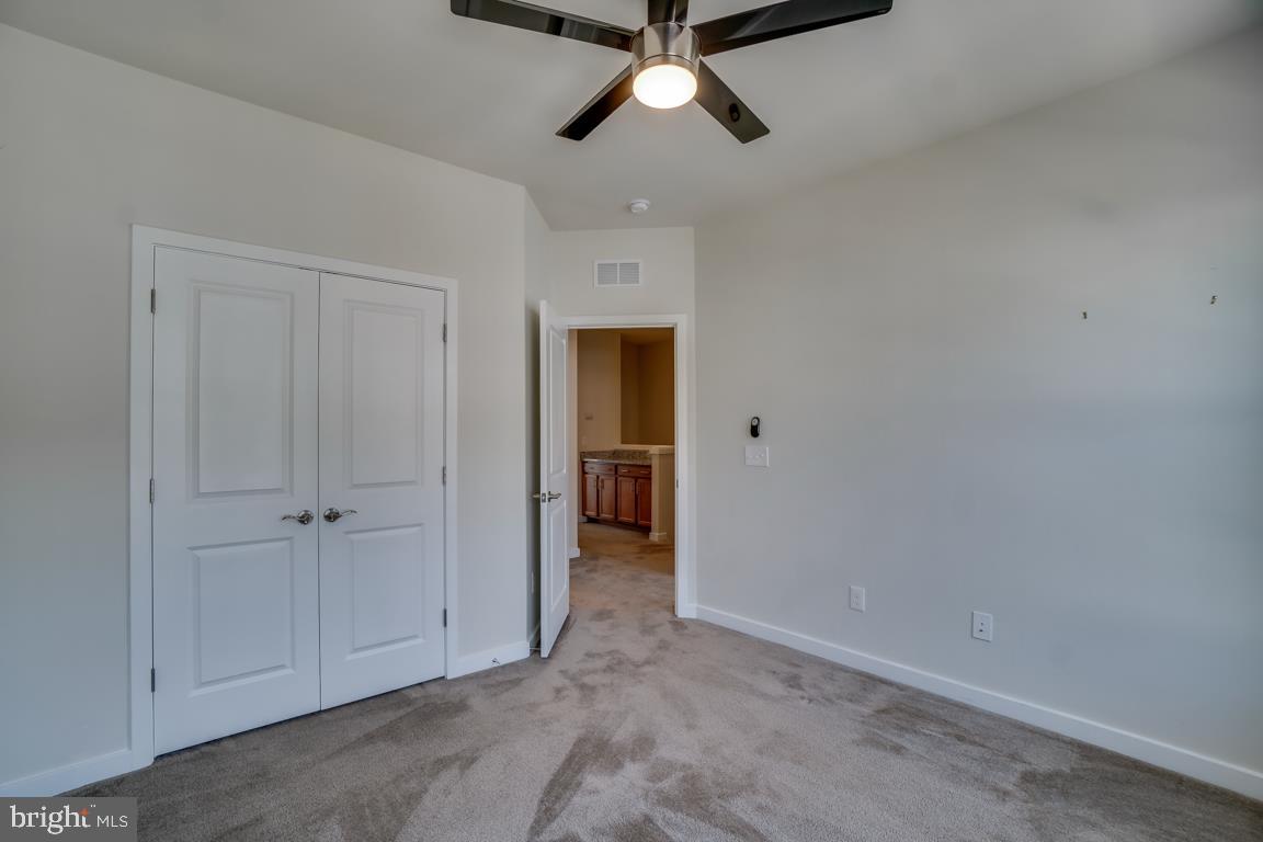 19958 Abram Terrace Ashburn, VA 20147 - Photo 30 of 41 an empty room with closet and a ceiling fan