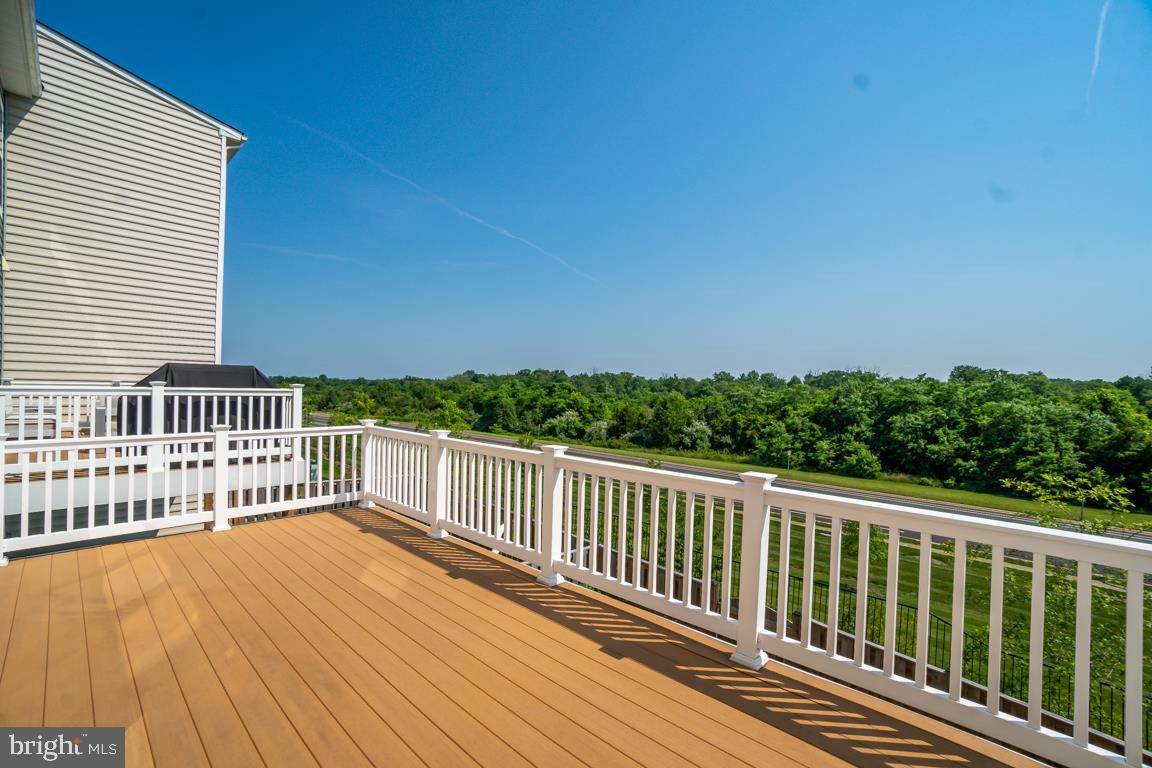 19958 Abram Terrace Ashburn, VA 20147 - Photo 32 of 41 a view of a balcony with wooden floor