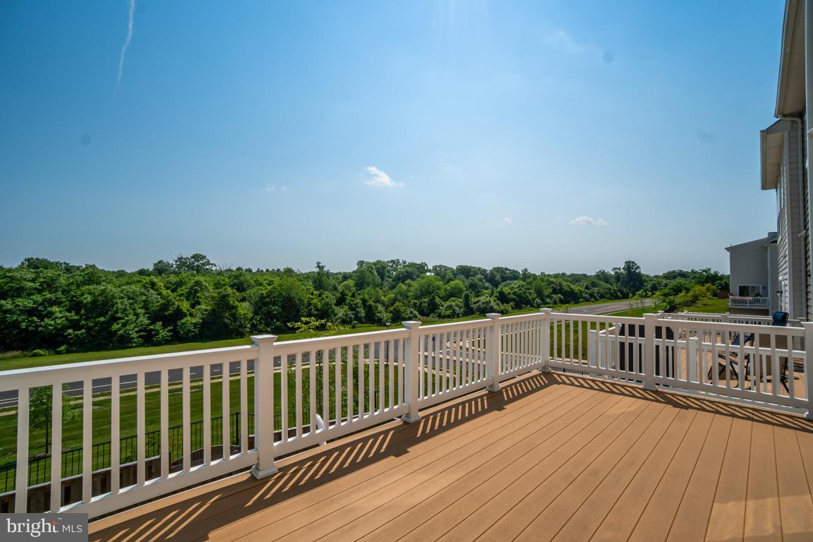 19958 Abram Terrace Ashburn, VA 20147 - Photo 33 of 41 a view of balcony with wooden floor and fence