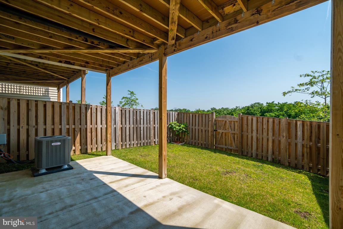 19958 Abram Terrace Ashburn, VA 20147 - Photo 39 of 41 a view of a backyard with wooden fence