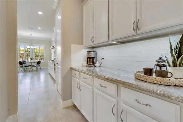 a kitchen with sink and cabinets