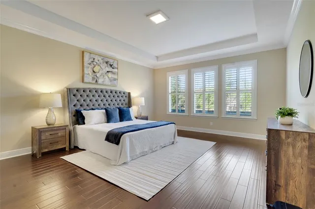 a bedroom with a bed and a night stand