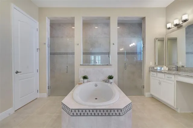 a bathroom with a tub and shower