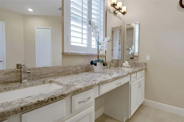 a view of staircase with wooden floor and white walls