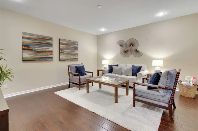 a dining room with furniture window and wooden floor