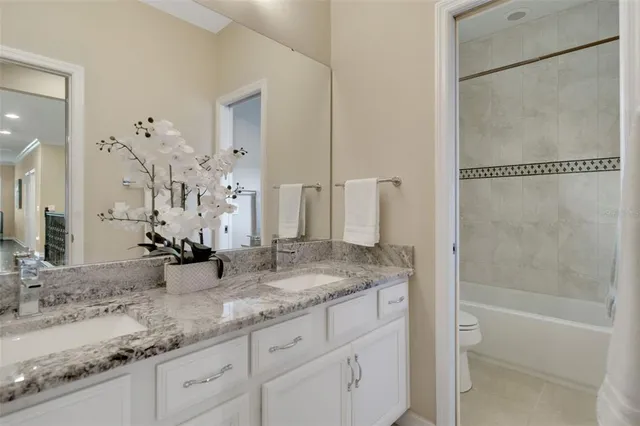 a bedroom with a bed and windows