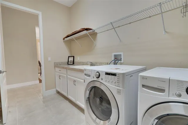 an aerial view of multiple houses with a big yard