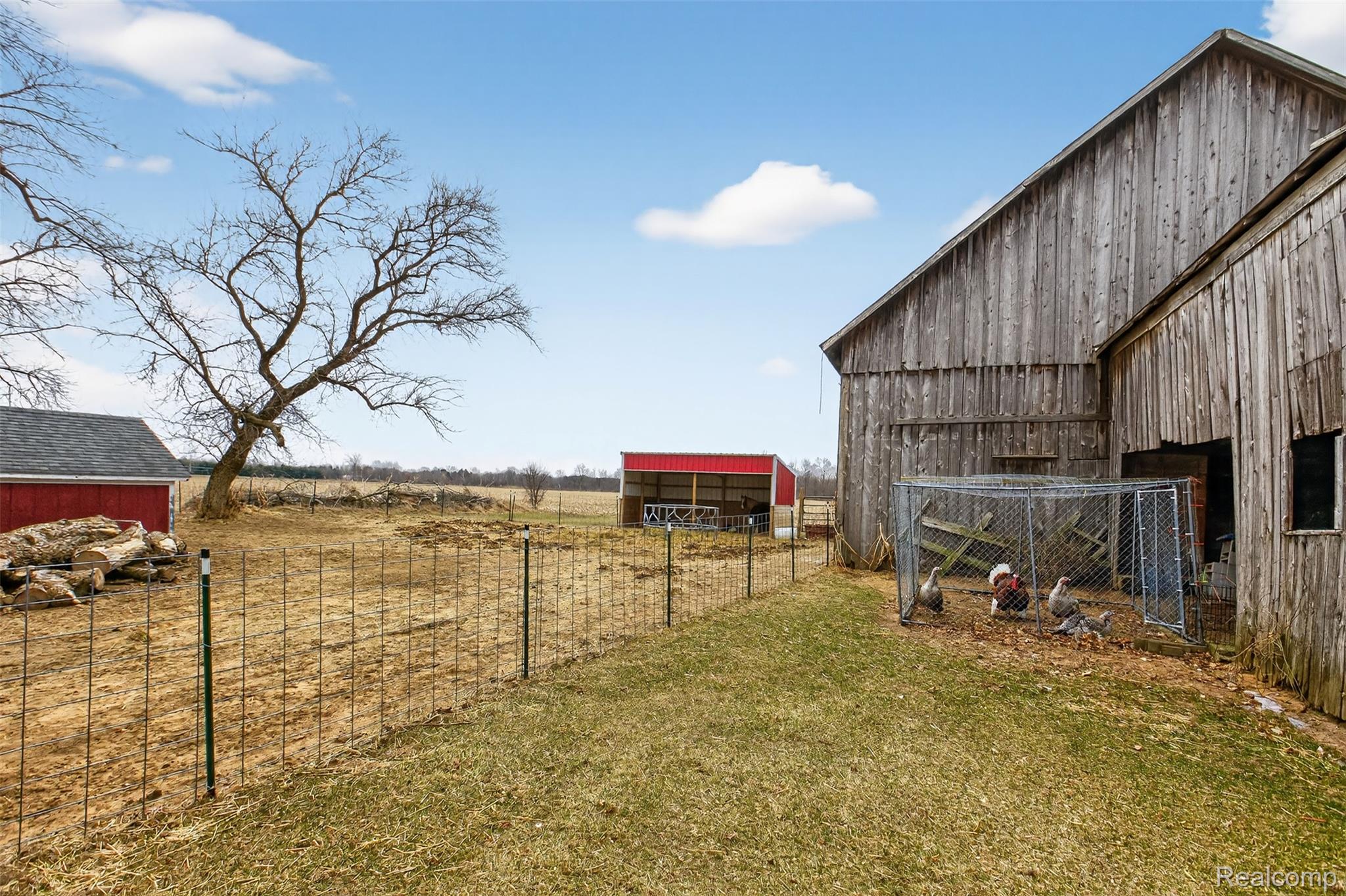 5639 Swaffer Road Millington, MI 48746 - Photo 19 of 25 View of yard featuring an outbuilding and a view of rural / pastoral area