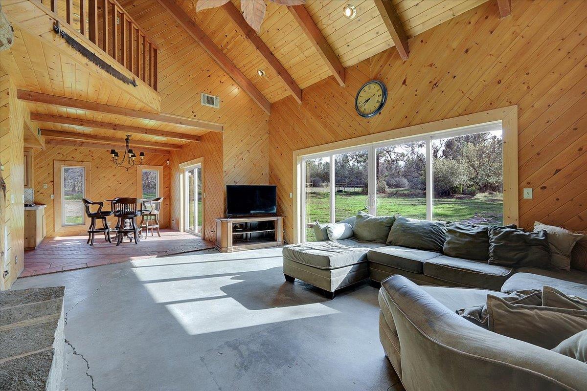 13980 Mountain House Road Penn Valley, CA 95946 - Photo 14 of 58 a living room with furniture and a large window