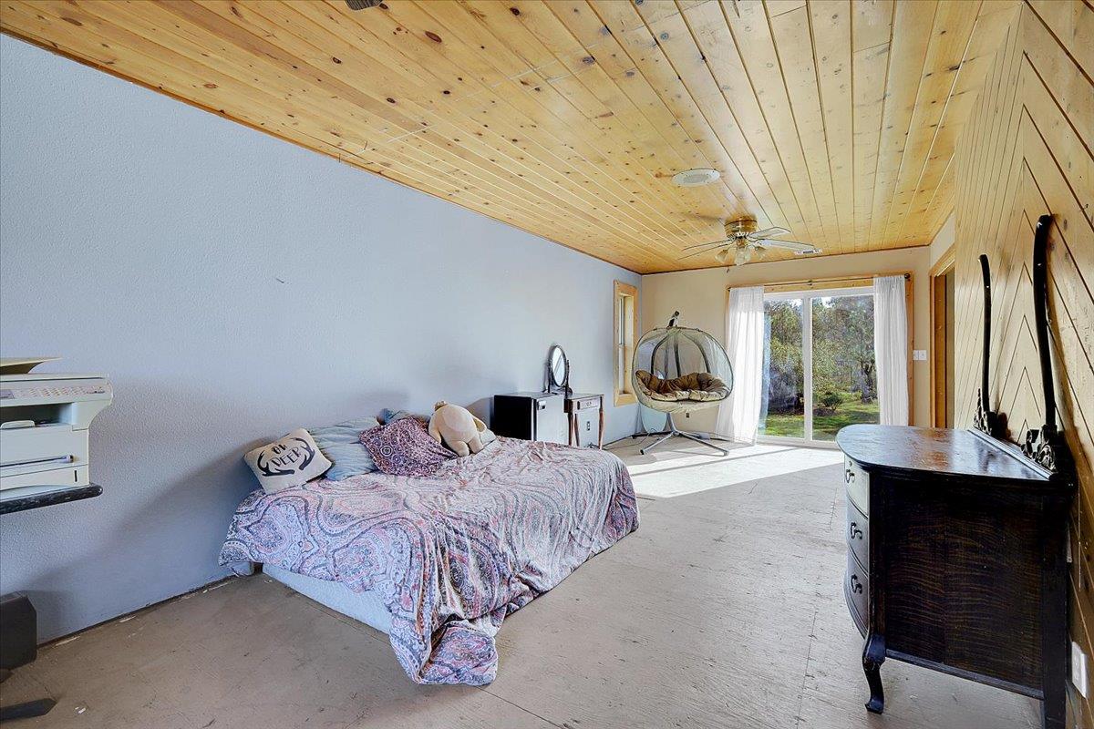 13980 Mountain House Road Penn Valley, CA 95946 - Photo 34 of 58 a bedroom with a bed and window