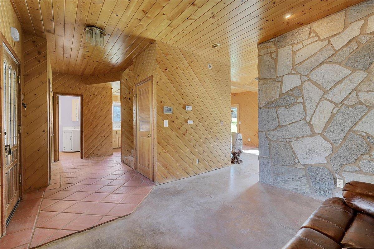 13980 Mountain House Road Penn Valley, CA 95946 - Photo 8 of 58 a view of a hallway with wooden shelves