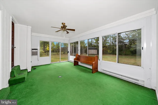 a view of a backyard with a garden and deck