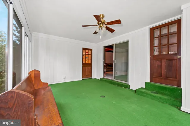 a view of a bedroom with window and furniture