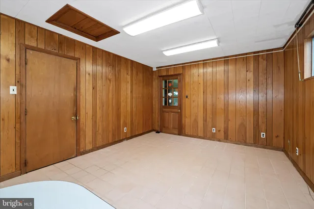 a bathroom with a toilet a sink and a mirror