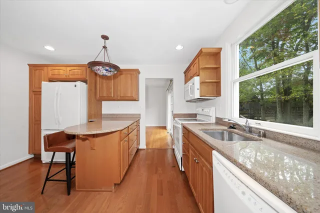 a kitchen with a sink a counter top space and appliances