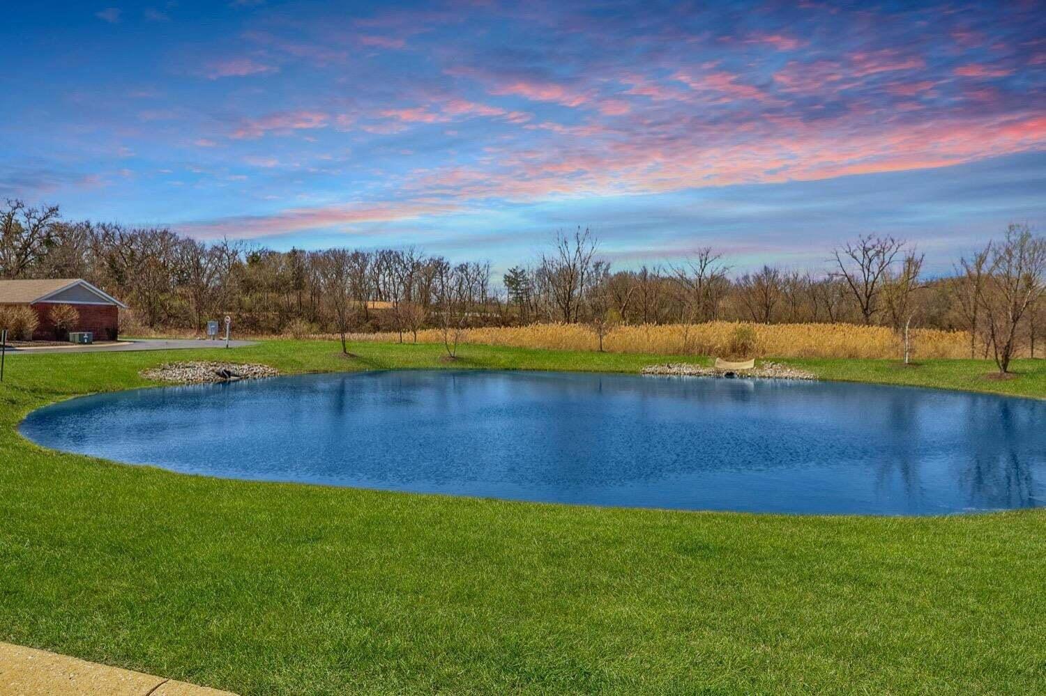 11840 Broadway Crown Point, IN 46307 - Photo 15 of 18 a view of a lake with houses in the back