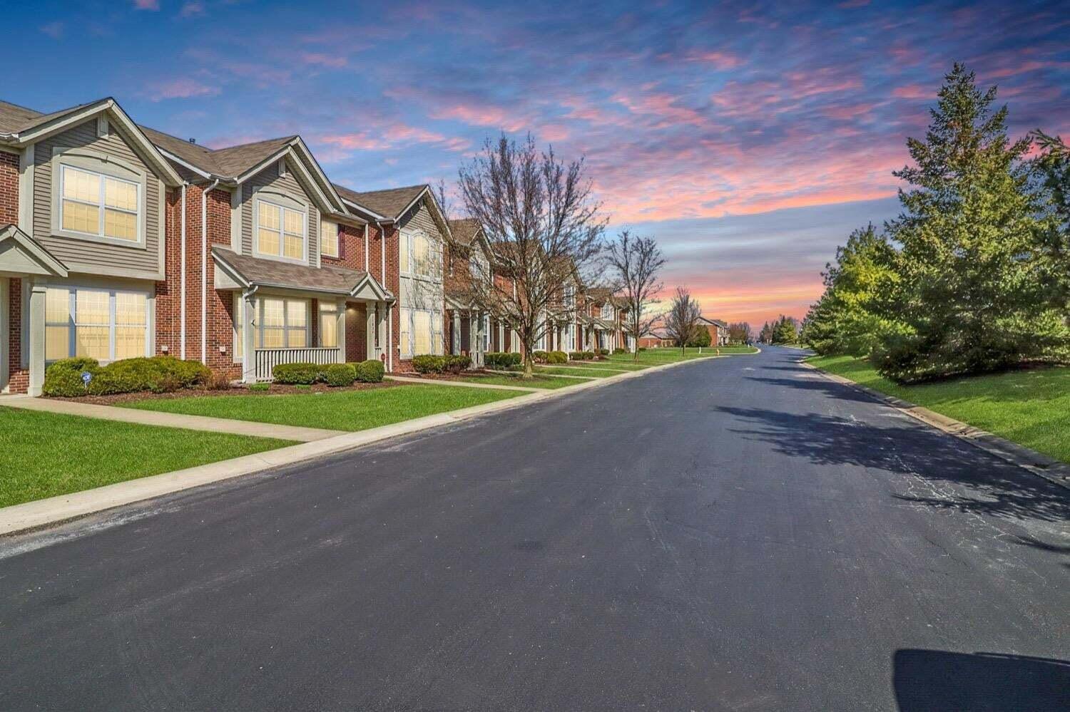 11840 Broadway Crown Point, IN 46307 - Photo 17 of 18 a view of a house with a big yard and palm trees