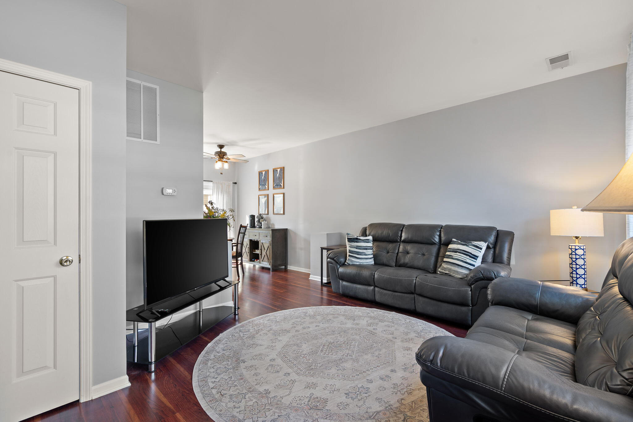 11840 Broadway Crown Point, IN 46307 - Photo 3 of 18 a living room with furniture and a flat screen tv
