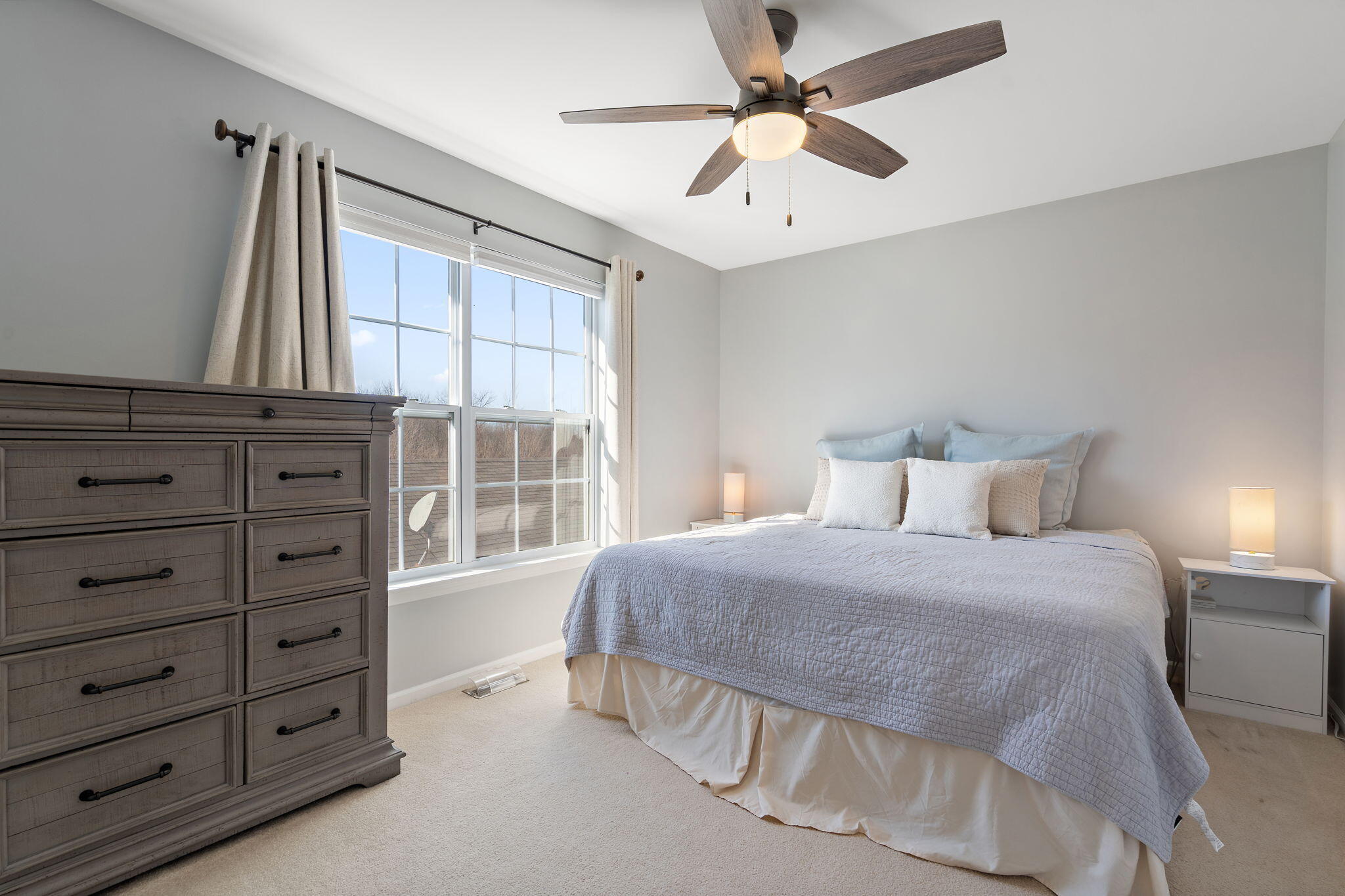11840 Broadway Crown Point, IN 46307 - Photo 9 of 18 a bedroom with a large bed and a chandelier