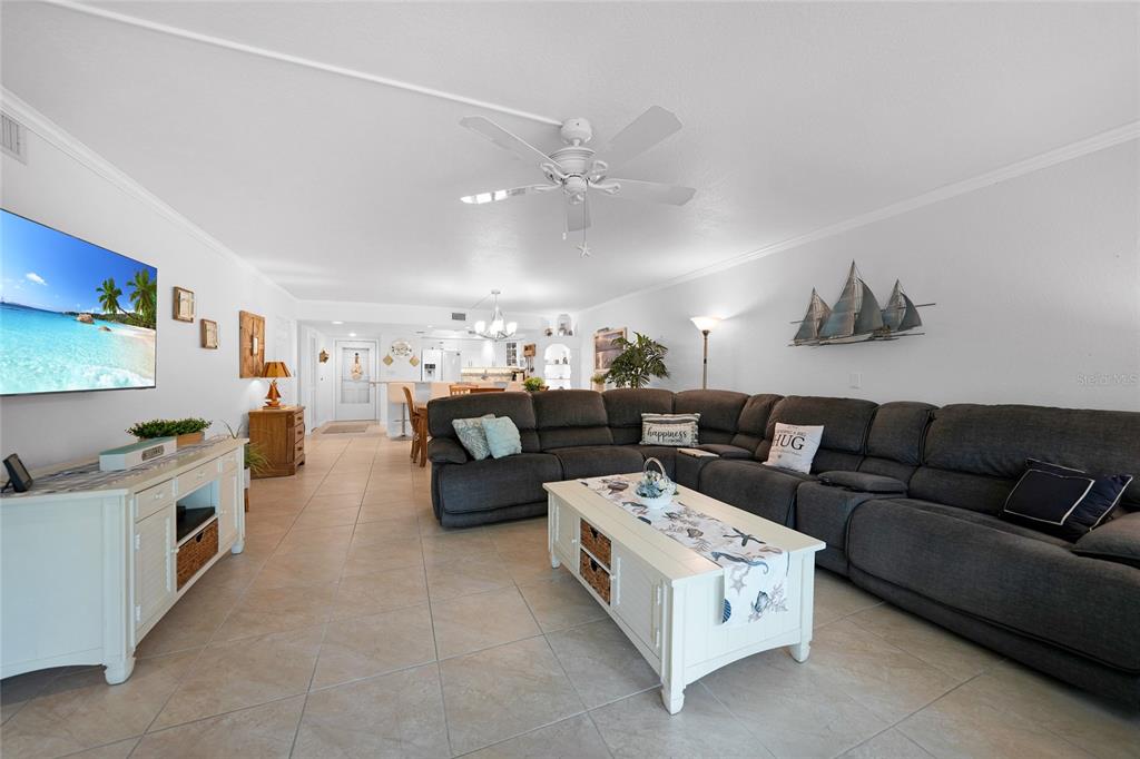 601 Shreve Street, Unit 16A Punta Gorda, FL 33950 - Photo 12 of 52 a living room with furniture and a chandelier
