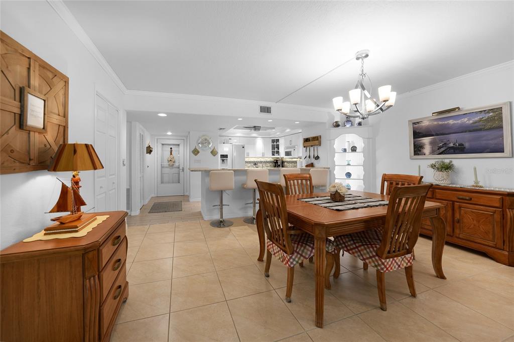 601 Shreve Street, Unit 16A Punta Gorda, FL 33950 - Photo 17 of 52 a view of a dining room with furniture and chandelier