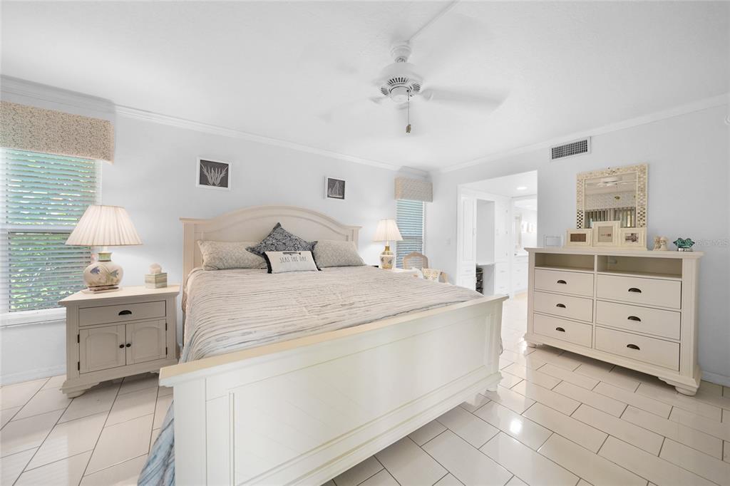 601 Shreve Street, Unit 16A Punta Gorda, FL 33950 - Photo 20 of 52 a bedroom with a bed and a dresser