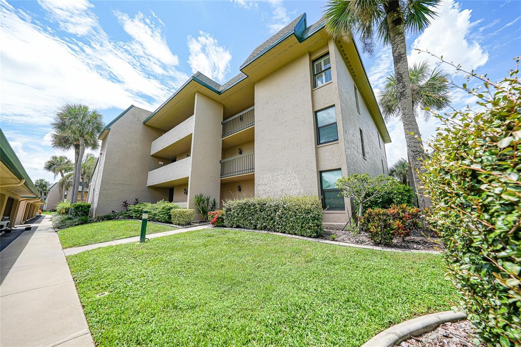 601 Shreve Street, Unit 16A Punta Gorda, FL 33950 - Photo 2 of 52 a view of a house with a yard