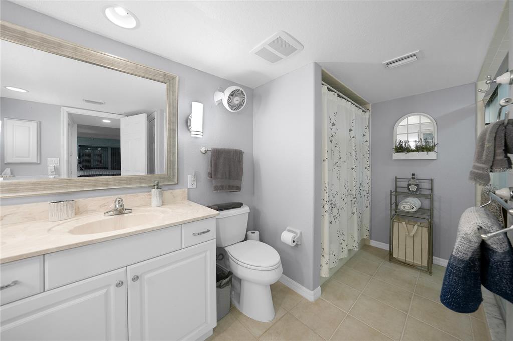 601 Shreve Street, Unit 16A Punta Gorda, FL 33950 - Photo 27 of 52 a spacious bathroom with a toilet sink and mirror