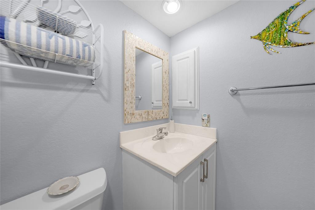 601 Shreve Street, Unit 16A Punta Gorda, FL 33950 - Photo 31 of 52 a bathroom with a sink a toilet and a mirror