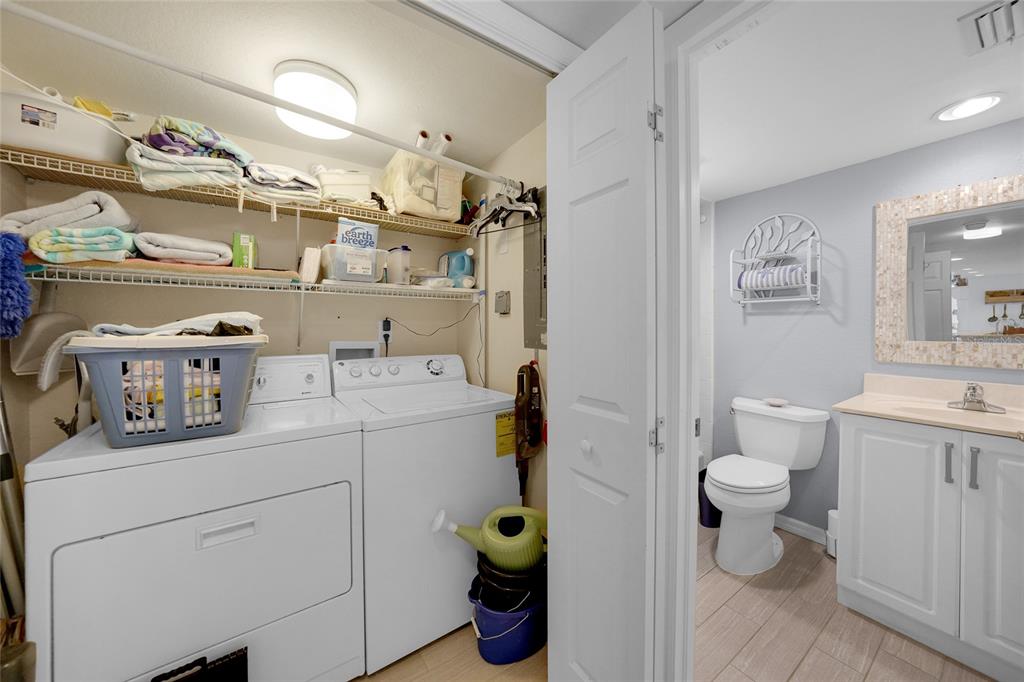 601 Shreve Street, Unit 16A Punta Gorda, FL 33950 - Photo 32 of 52 a utility room with cabinets dryer and washer