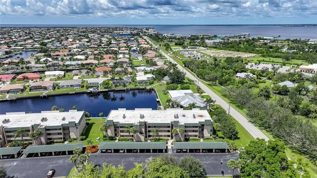 a view of house with yard and ocean view